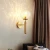 Import Hotel indoor decorative gold black metal modern led glass wall sconce from China
