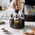 Import 6 Jar Revolving Spice Rack Organizer Lead Free Glass Seasoning Box Cruet Bottle Condiment Jar set from China
