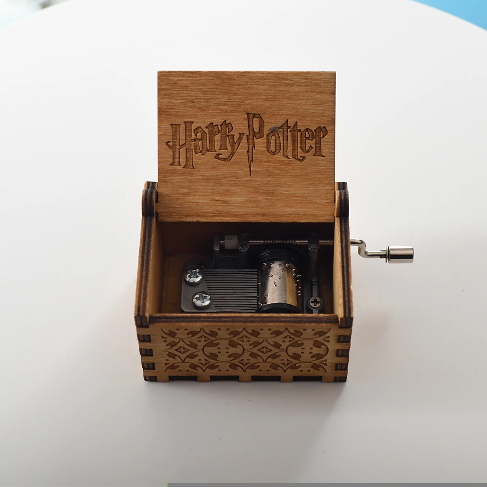 Carved wooden hand crank  harry potter music box