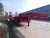 Import Hot heavy duty 60 ton low flatbed semi trailer low bed truck trailer trucks and trailers from China