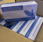 Disposable nitrile examination gloves