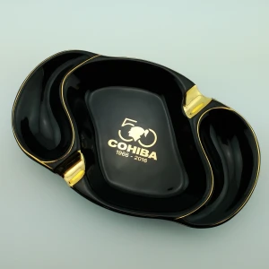 Best selling oval ceramic ashtray with golden edge with two golden rest with customized logo for sale