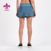 High quality wholesale women&#39;s revolve sports short skirts For Tennis with back zip pocket detail fitness wear