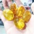 Import Natural yellow crystal energy healing stone fire and Ice crackled quartz citrine palm stone from China