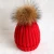 Import real fur pom pom winter hat custom knit hat for woman from China