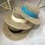 Import Travel Natural seagrass hollow flat brim hat ladies summer porkpie concave round sun straw hat with ribbon from China