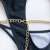 Import YB76328 popular solid color brazilian bikinis metal chain belt cut out one piece swimsuit from China