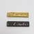 Import Custom  New Design  Small Gold  Embossed Logo  Metal Label  With  Two Sewing Hole  In Bag Parts Accessories from China