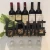 Import Decorative Black Home Wall Mounted Hanging Metal Wine Bottle Rack Holder with 4 Glass Holder &amp; Wine Cork Storage from China