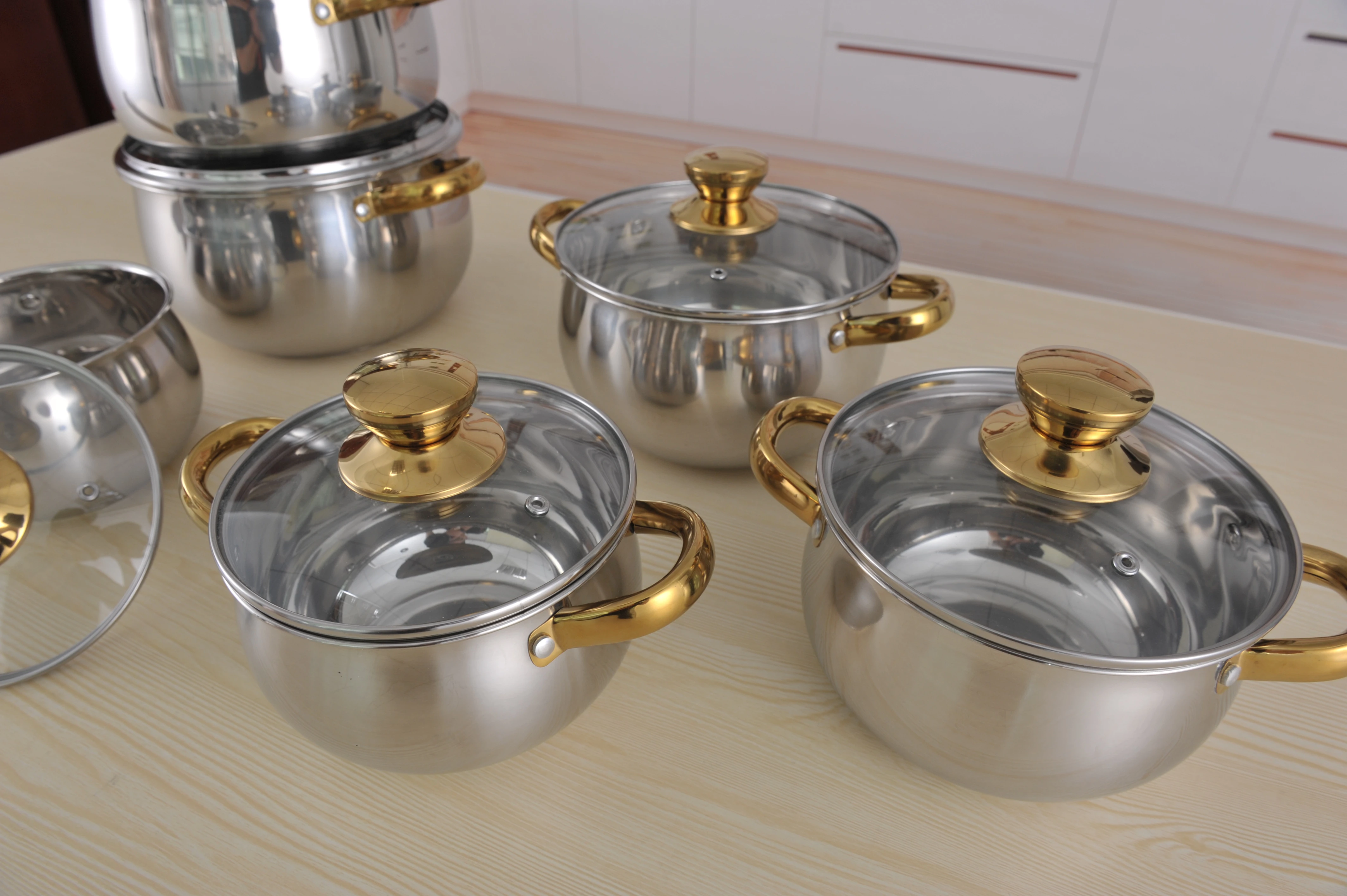 https://img2.tradewheel.com/uploads/images/products/7/0/newest-12pcs-stainless-steel-thomas-inox-cookware-set-inox-cooking-pot-with-gold-handle-cookware-sets1-0382852001626049529.jpg.webp