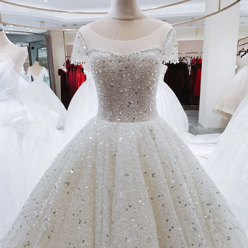 Round neckline short sleeves applique embroidery ball gown with sequins material wedding dress