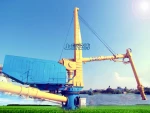 Screw ship unloader with tower and winch
