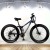Import 26 inch snow mountain bike bicycle aluminum alloy thick rim 21 speed front fork shock absorber double disc brakes 4.0 tires from China