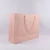 Import custom printed logo high quality pink rose luxury drawstring paper gift bag for garment from China