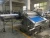 Import Poultry meat continous belt type vacuum packing machine DZ-1090 sealing machine from China