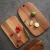 Import High-end Black Rectangle Slotted Acacia Wood Home Kitchen Bread Chopping Cutting Board with Holes from China