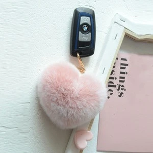 Wholesale raccoon dog fur ball pom pom keychain fluffy pom poms for bag pink faux fur heart ball key chains bulk