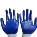 Blue rubber gloves nitrile working and grey construction work