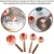 Import Low MOQ Kitchen Stainless Steel Mirror Polished Rose Gold Measuring Cups Tool Set with Wood Handle from China