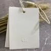 Luxury thick paper custom made garment hangtag swing hang tag rope Embossed label clothing accessories price tag