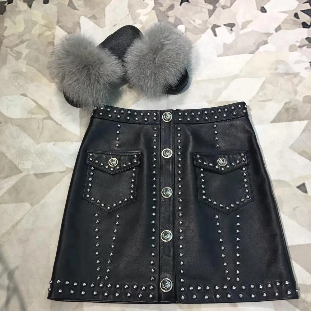 OEM Popular ladies clothes black girl tight rivet skirts casual sexy party girls punk mini leather skirt with button