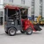 Import High Safety Compact Electric Wheel Loader HT-150E 750kg 4-5h Working Time Mini Loader from China