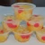 Import canned fruit cocktail in fruit cup with sleeve from China