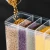 Import Kitchen Wall-Mounted Clear Plastic Storage Box PP Material Cereal Dispenser Dry Food Whole Grain Rice Bucket Rice Storage Bin from China