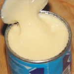 Sweetened condensed milk. Condensed milk with sugar. Belarus