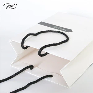 Wholesale folded shopping art paper white gift paper bag