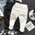 Import YY10292B Ripped design kids children stretch jeans black and white cotton trousers boy denim jeans wholesale from China
