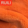 Solid color orange fake faux rabbit fur plush fabric