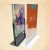 Import A4 acrylic metal base Makeup Scissors store display Under Eye Pads poster stand Face Lotion sign holder from China