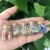 Import Factory Customized Wholesale Natural Crystal Rock Stone Mini Bottles Minerals Specimen Stone Wicca Reiki Healing Quartz from China