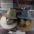 Import fashion belt panama hat decorated shell outdoor sun protection paper braid straw fedora hat wide brim from China