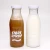 Import 200ml 250ml 500ml 1000ml customized round glass milk bottle with metal cap from China
