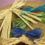 Import Asun paper yarn Raw Raffia Manufacturers Orange Colored Raffia Biodegradable Grass for Gift Box Filler Packing rafia string from China