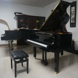 Black Grand Piano with piano bench and accessories