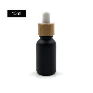 Hot sell vaping 5ml 10ml 15ml 20ml 30ml 50ml 100ml matte black glass essential oil bottles with bamboo protective dropper cap
