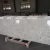 Import Wholesale Natural Stone Tops River White Granite Countertop from China