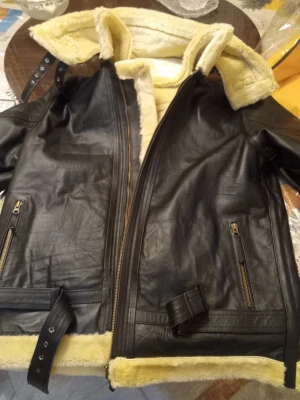 Black fur leather jacket.
