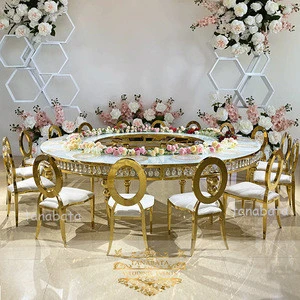 banquet hall wedding event golden metal base glass top wedding table