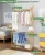 Import New Bamboo Rolling Garment Clothes Laundry Rack with 4 Tree Stand Coat Hooks Shoe Storage Shelves from China
