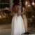 Import Free Shipping A-Line Spaghetti Straps Prom Party Dress Backless Tea-Length White Satin with Pockets Ruched from China