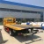 Import 6 tons japan brand 4x2 flatbed tow truck from China