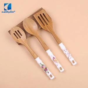 Cathylin wooden kitchen tool set , ceramics handle colored kitchen utensils