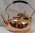 Import Copper tea kettle with wooden handle from India