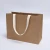 Import Custom Printed Degradable Brown Kraft Paper Bag Packaging Clothing Shopping Bag from China