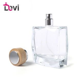 Devi Wholesale OEM/ODM  Hand Polishing Fire Polishing   Empty Perfume Glass Bottle With Round Wooden and Plastic Cap