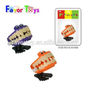 Hot sale promotional novelty plastic jumping teeth wind up toy